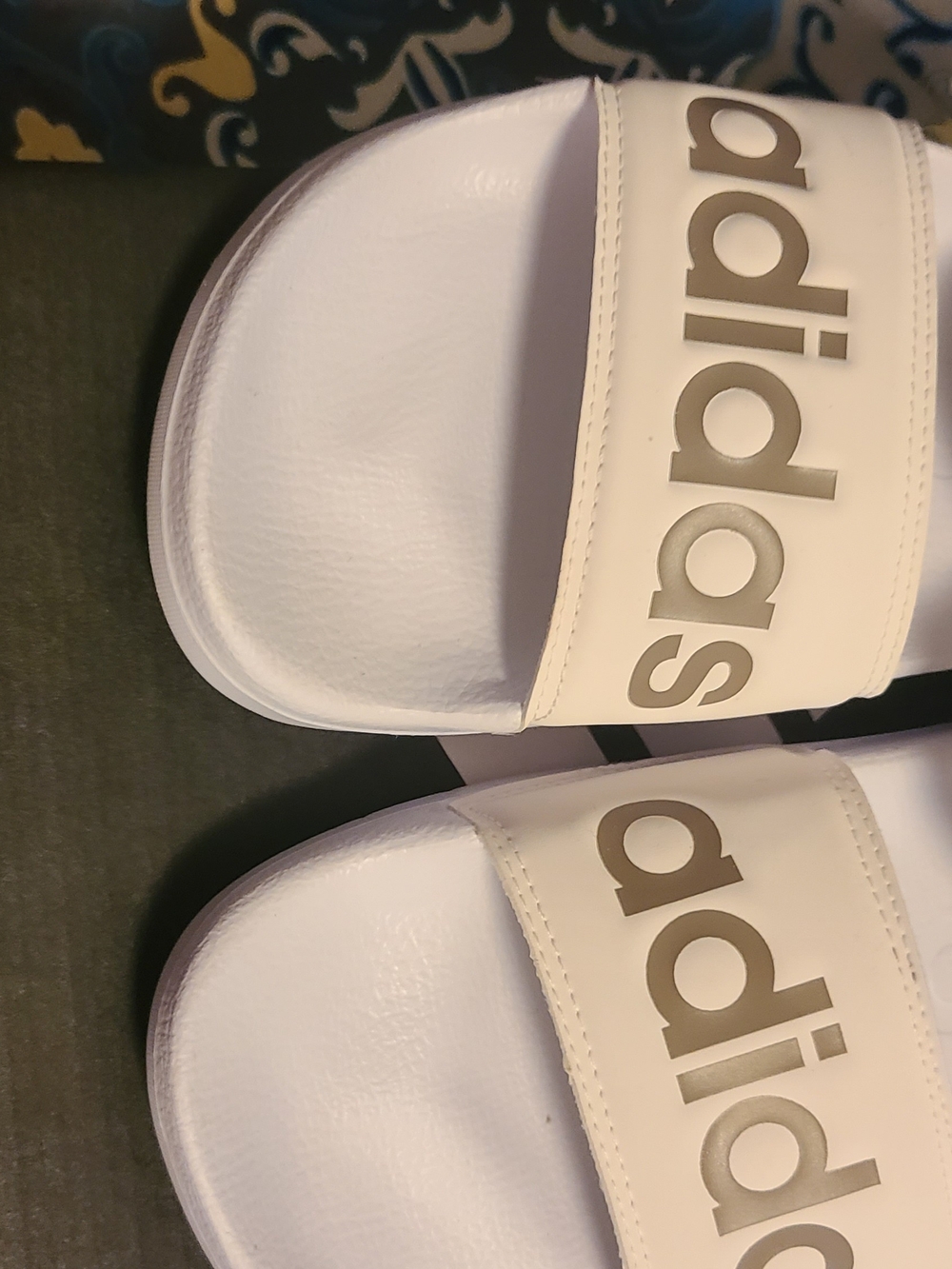 adidas Women’s White Slide Sandals with Gold Logo